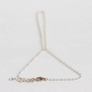 Simple silver handchain bracelet made with sterling silver.  Adjustable so one size fits all.  Handmade.  Chains by Lauren