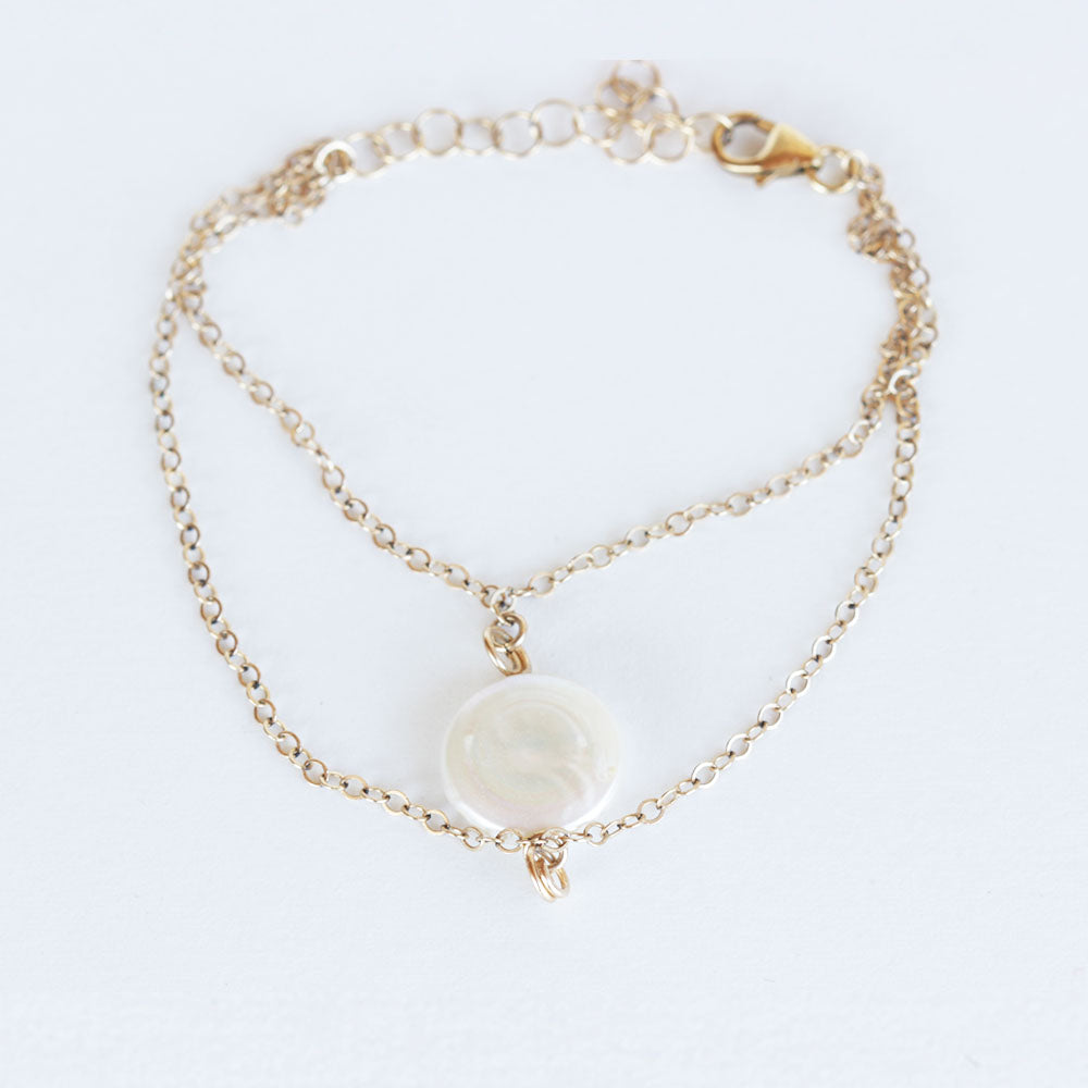 Pearl charm bracelet.  Made with a fresh water pearl and gold fill chain.  Chains by Lauren.