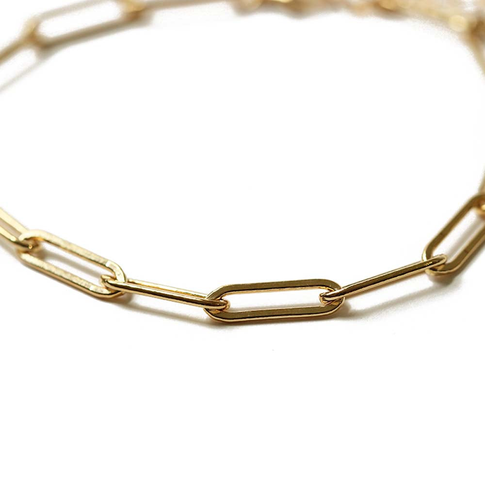 Close up of the paper clip gold chain charm bracelet. Adjustable so one size fits all. Chains by Lauren