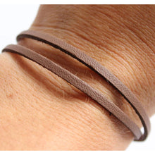 Unisex Brown double  Wrap Bracelet.  Secures with a magnetic closure, made from leather and safety lock.  Chains by Lauren