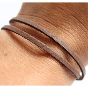 Unisex Brown double  Wrap Bracelet.  Secures with a magnetic closure, made from leather and safety lock.  Chains by Lauren