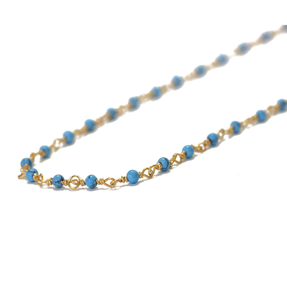 The perfect turquoise layering choker.  Made from turquoise, gold plated silver wire, gold filled extension and a gold filled lobster claw.  Chains by Lauren 