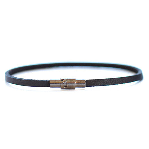 Unisex thin black leather bracelet secure magnetically with a safety lock.  Chains by Lauren