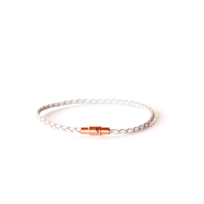 Women's thin white leather bracelet with a rose gold magnetic closure.  Available in a range of sizes.